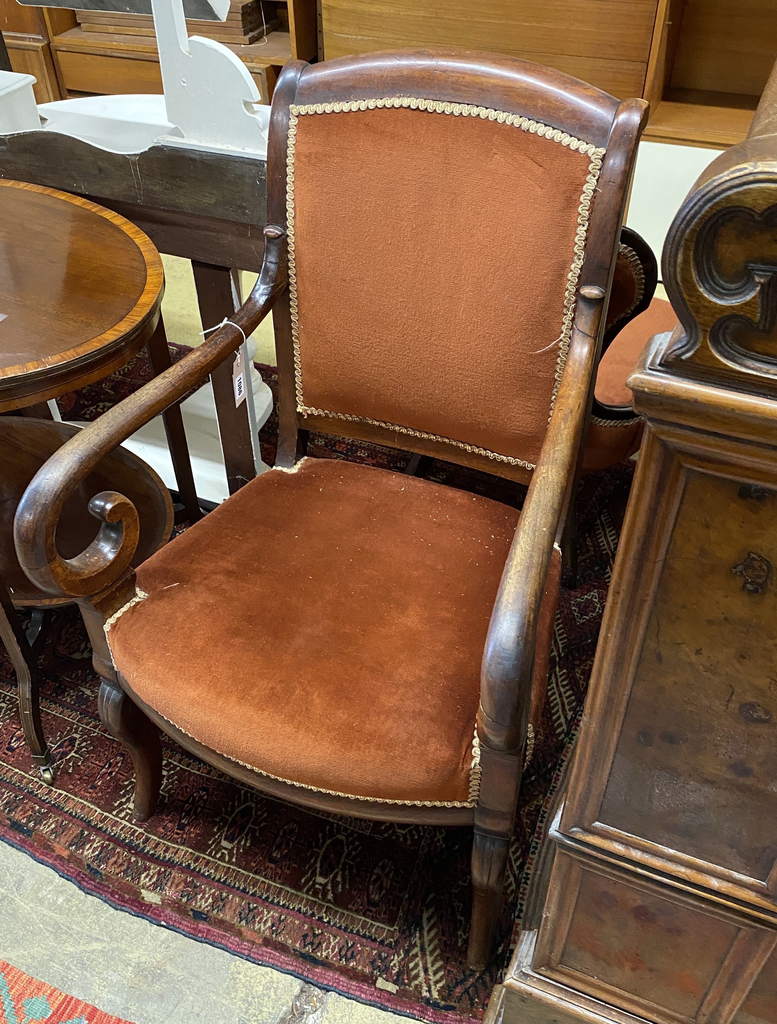 A French Empire mahogany fauteuil, with scroll over arms, width 56cm, depth 48cm, height 96cm